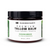 Dark plastic round jar with white and green front label with black and green lettering