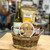 Small brown wicker basket filled with brown crinkle paper and snacks. See product description for full details of what items are included.