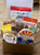 glossy gold gift box displaying contents of gift. Complete list of items in product description.