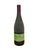 Dark glass wine bottle lightly covered with dirt from the vineyard with a green label
