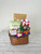 Brown oval gift basket displaying contents of gift