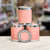 Round tin container with lid with light pink label and white lettering