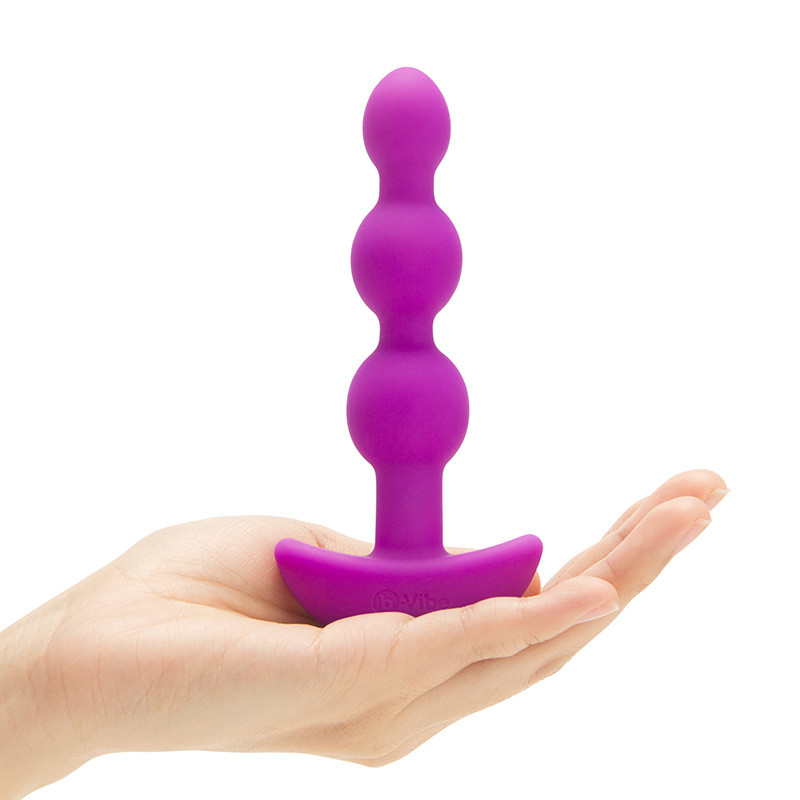 Fuchsia b-Vibe Remote Control Triplet Anal Beads - Hand #1