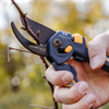 A hand cutting a woody stem with the Super Duty MaxForce Bypass Pruner