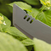 Close-up of the Heavy Duty Machete blade showing the three cutouts near the tip