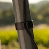 Close-up of the cord management clip holding the rope against the pruner pole