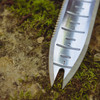 Close-up of the Hori Hori blade tip showing the notched weeding fork and the 1 to 3 inch depth markings