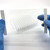 PCRSEAL-OB optical film held over 96-well plate demonstrating clarity and transparenc
