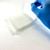 Peeling PCRSEAL-OB optical clear qPCR sealing film from 96-well plate with gloved hand