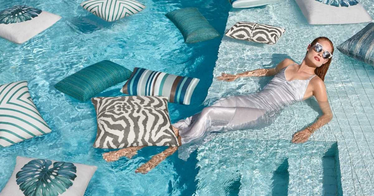 Elaine Smith Sunbrella outdoor pillows in a pool setting