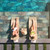 Ribbon chaise pair on pool ledge