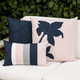 rose quartz pillow on sofa with 2 coordinating patterns