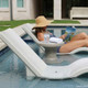 Sandstone Fluent Table in Pool with Line Loungers