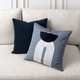 Modern Balance Paired with a solid Deep Blue Pillow