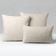 Scala Crema square and lumbar pillows styled on a neutral indoor sofa