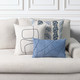 Illusion Ocean Lumbar pillow styled on an indoor neutral sofa