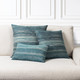 Textured Lagoon square and lumbar pillows styled on a neutral indoor sofa