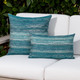 Textured Lagoon square and lumbar pillows styled on a neutral outoor sofa
