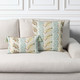 Revival Anew square and lumbar pillows styled on a neutral indoor sofa