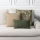 
Cadence Sienna square and lumbar pillows styled with basketweave fern pillow on an indoor sofa