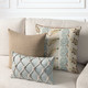 Cadence Sienna square  pillow styled on a neutral indoor sofa