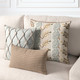 Cadence Sienna lumbar pillow styled on a neutral indoor sofa with coordinating fabric pillows