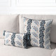 Revival Lapis square and lumbar pillows styled on a neutral indoor sofa