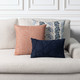 Revival Lapis square pillow styled on a neutral indoor sofa