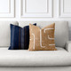 Caramel Pillow Package styled on a neutral indoor sofa | Instinct Caramel and Journey Indigo
