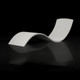 Front view of Curve polished concrete in-pool lounger in studio setting with black background