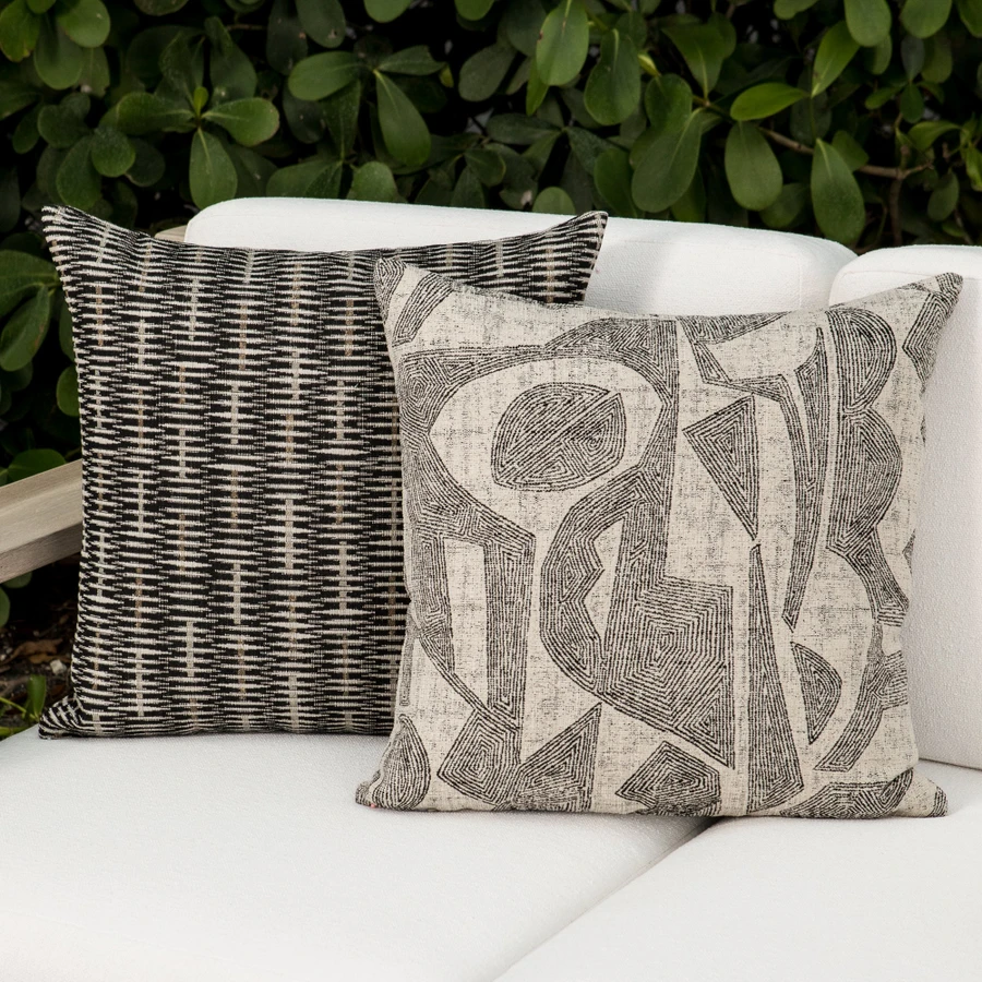 Ebony Pillow Package styled on a neutral outdoor sofa | Influence Ebony and Intertwine Ebony