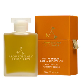 Aromatherapy Associates Desert Therapy Bath and Shower Oil - 55ml bottle & orange carton box; A luxurious bath and shower oil with frankincense, sandalwood and oud that nourishes skin and transforms daily bathing into a calming ritual.