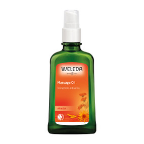 Weleda Arnica Massage Oil 100ml in a green glass bottle with orange label & white cap; A 100% natural, vegan-friendly body oil that warms, relaxes, and supports muscle recovery while improving skin elasticity.