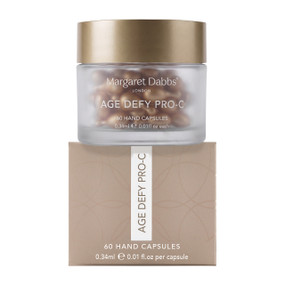 Margaret Dabbs London Age Defy Pro-C 60 Hand Capsules jar and box; Margaret Dabbs Age Defy Pro-C Hand Serum Capsules with Pro-Vitamin C and Ceramides help brighten uneven skin tone and improve the appearance of skin firmness.