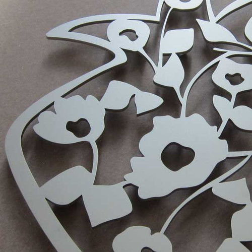 Stainless Steel Pomegranate-Shaped Trivet with blooming flower design by Melanie Dankowicz