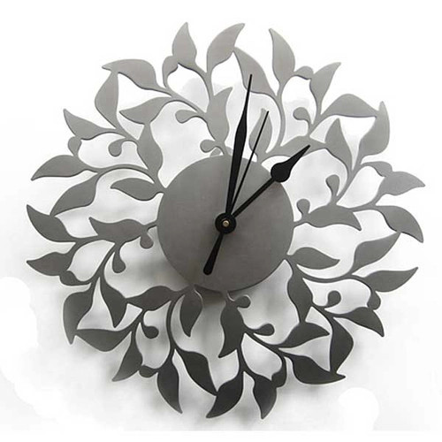 Clock with vine motif, lasercut from stainless steel — Melanie Dankowicz