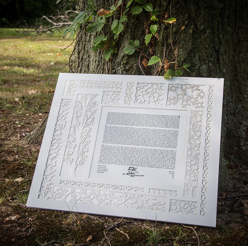 Terrace Papercut Ketubah displayed by a tree, design by Melanie Dankowicz