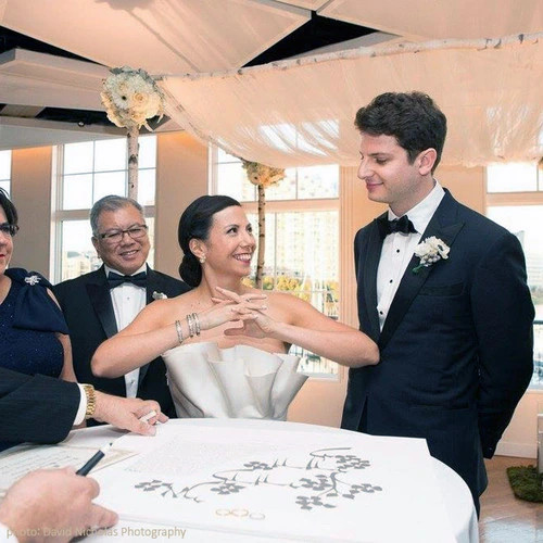 Groom signing Dodi Li Papercut Ketubah during ceremony by Melanie Dankowicz