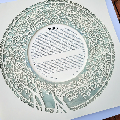 Blooming Tree Ketubah handpainted in misty green displayed outdoors by Melanie Dankowicz