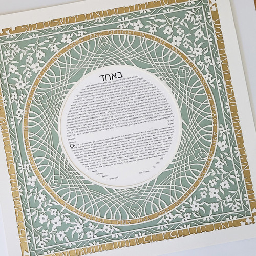The Festive Delight Ketubah in sage green and gold on angle -  Melanie Dankowicz