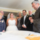Bride & groom signing Terrace Ketubah Opal by Melanie Dankowicz