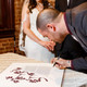 Dodi Li Papercut Ketubah in Dark Plum at wedding - Melanie Dankowicz Dodi Li Papercut Ketubah in Dark Plum at wedding - Melanie Dankowicz