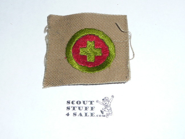 First Aid - Type A - Square Tan Merit Badge (1911-1933), black striped back