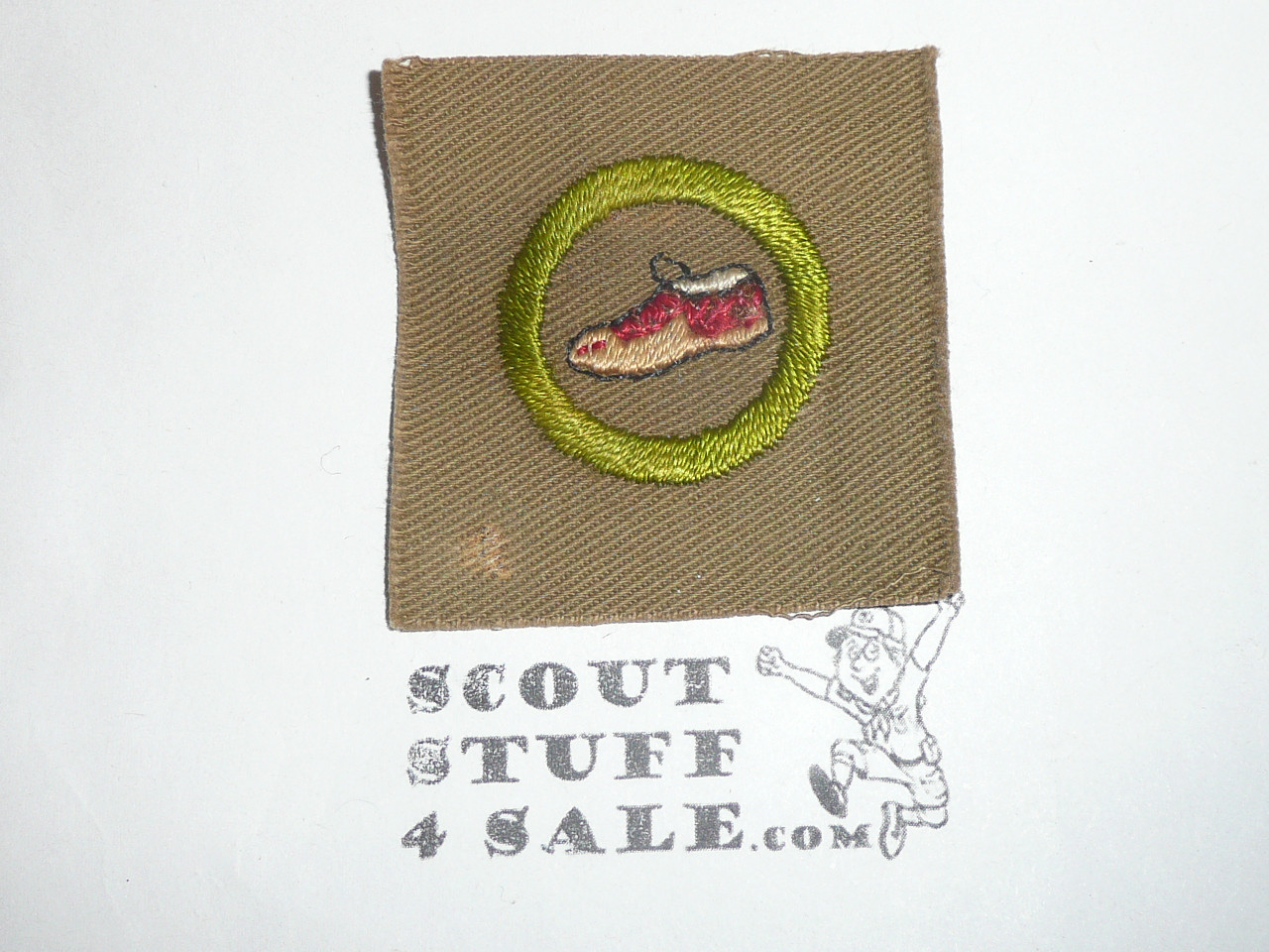Leatherworking (moccasin) - Type A - Square Tan Merit Badge (1911-1933), black striped back, MINT