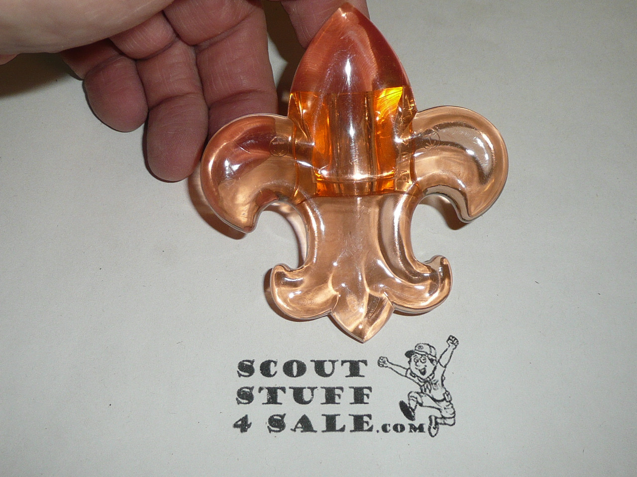 Molded Plastic Fleur-de-lis Neckerchief Slide, orange with plastic box by J-Mar