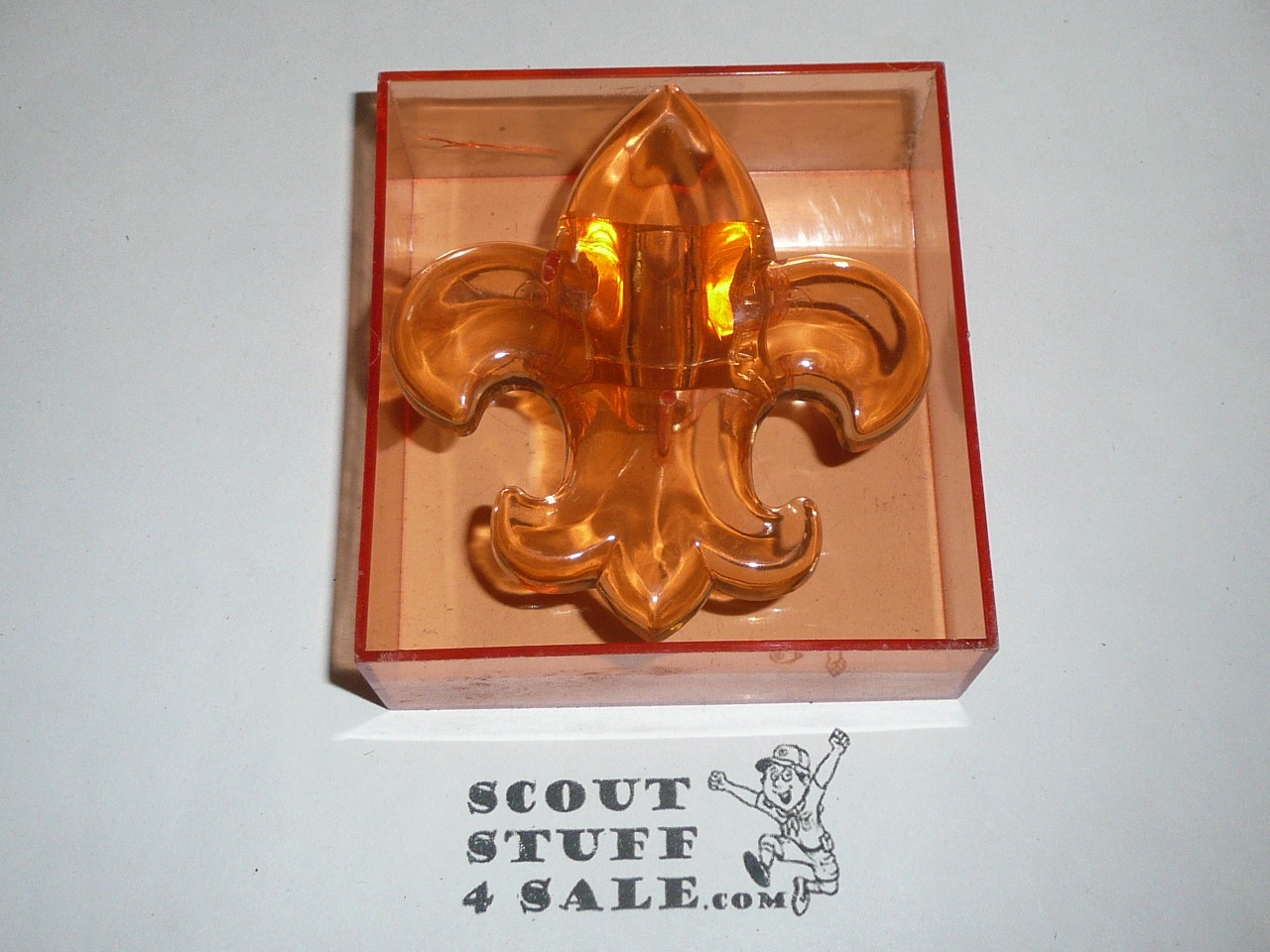 Molded Plastic Fleur-de-lis Neckerchief Slide, orange with plastic box by J-Mar