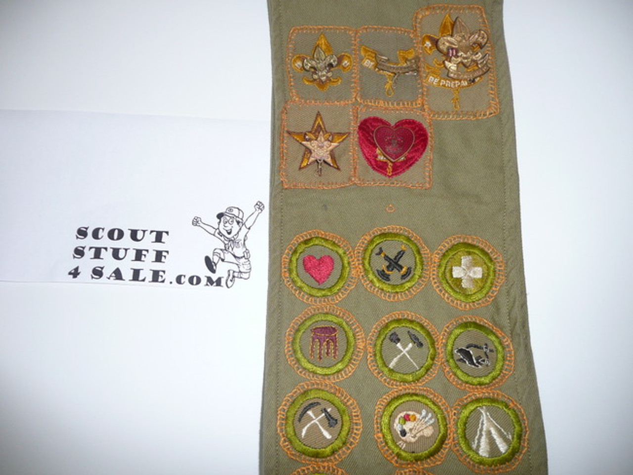 1940's Boy Scout Merit Badge Sash with 21 tan crimped merit badges (2 are Air Scout), 5 rank badges with pins, 1 scribe patch and a Houston KRS