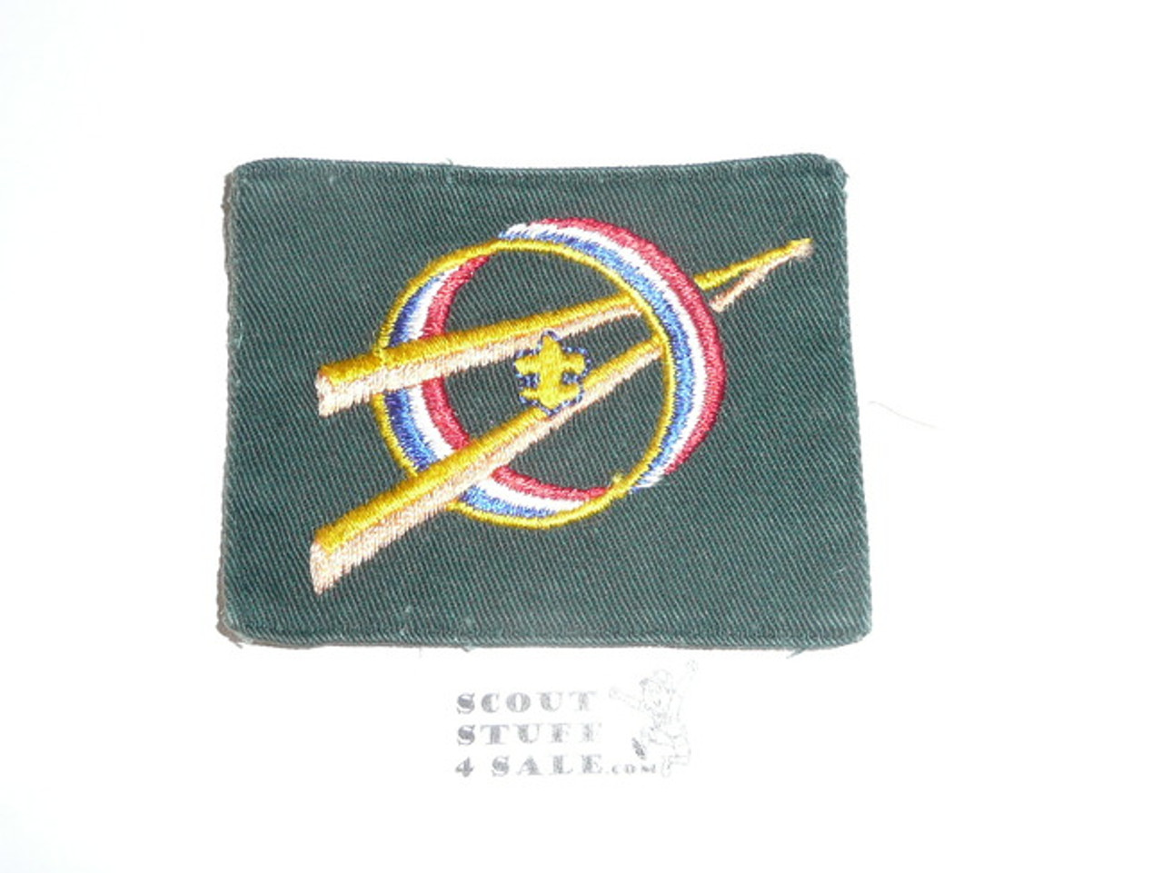 Explorer Scout Universal Emblem from the 1970's in Green with fold under edge, lt use