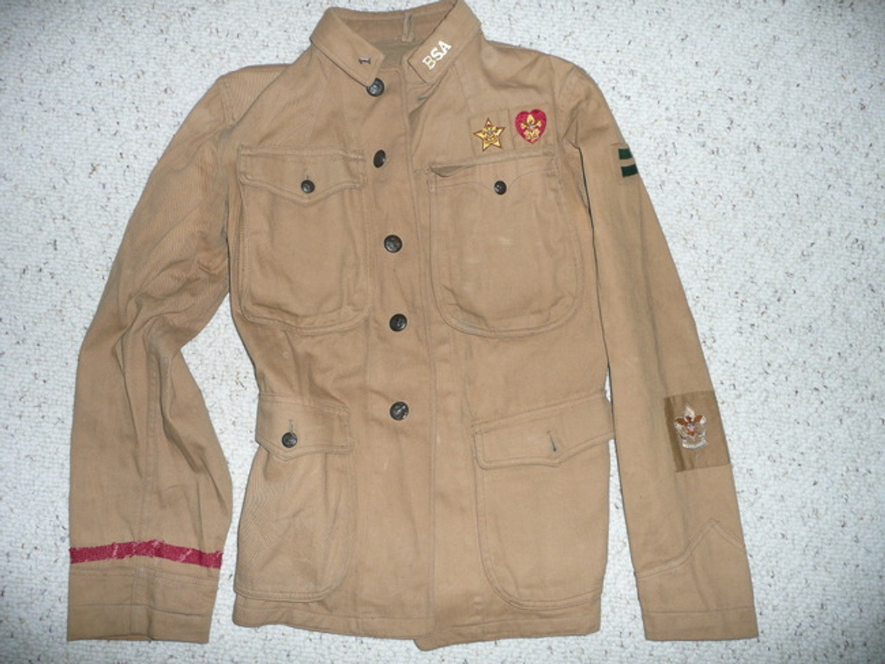 Teens Eisner Jacket with collar brass, 1st Class Patrol Leader, merit badges, early Patrol emblem and Type 1 Life and Star Patches
