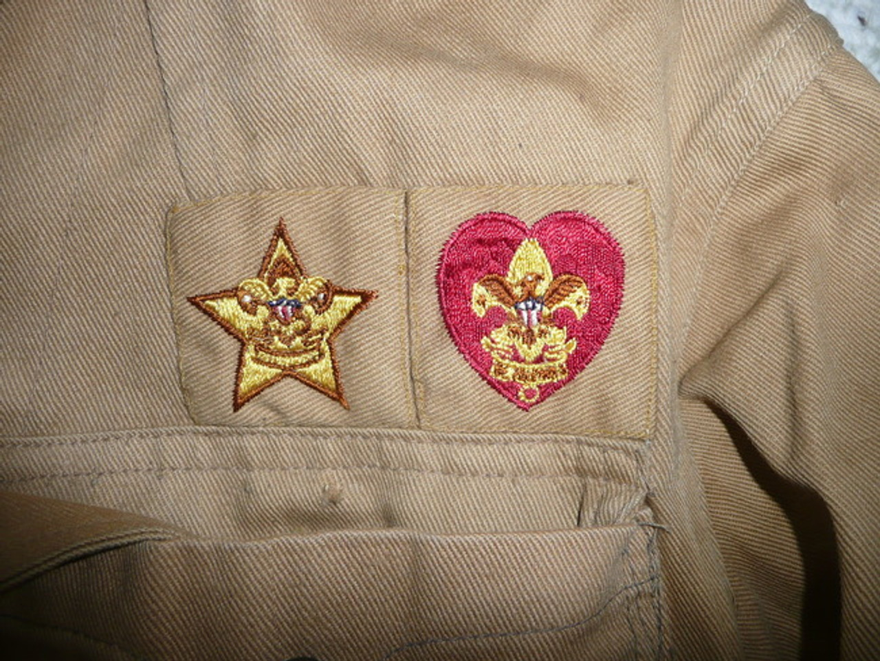 Teens Eisner Jacket with collar brass, 1st Class Patrol Leader, merit badges, early Patrol emblem and Type 1 Life and Star Patches